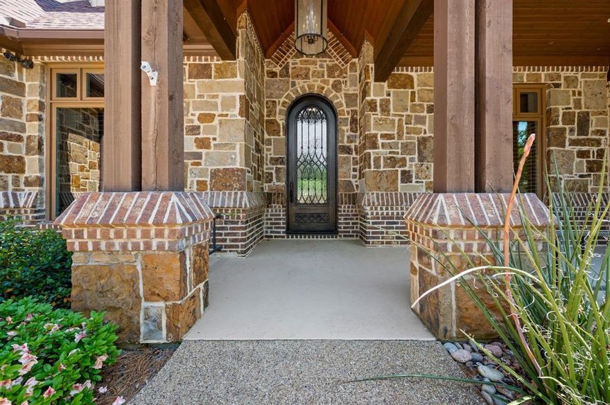 Nestled in exclusive Brown's Landing gated community on Lake Palestine, this Stunning 2.1-acre estate, with 442 ft of shoreline, invites you to dive into a lifestyle filled with sun, fun, & relaxation. Be wowed by the bright living area, soaring vaulted ceilings & cozy fireplace perfect for chilly evenings. Open layout flows beautifully into formal dining rm & gourmet kitchen featuring oversized island - ideal for whipping up delicious meals & hosting unforgettable parties! Picture sipping your morning coffee on your covered patio, warmed by wood-burning fireplace, as you soak in breathtaking sunrises over the shimmering lake. Need a cozy hangout? Versatile bonus rm with captivating views is perfect for family meals or lazy afternoons. Primary suite is a spacious sanctuary boasting impressive bathroom with coffee bar & private access to backyard. Thoughtfully designed lower level is an entertainer’s dream, featuring extra living area with fireplace, game rm with pool table, bar for mixing up your favorite drinks, & media rm with updated Full Swing golf simulator for year-round fun! This home comfortably sleeps 10+ guests with 3 additional bedrms ensuring ample space for family gatherings, weekend getaways, or entertaining friends. Step outside to your lower patio & embrace blissful waterfront living with bug misting systems around the house & dock—no pesky bugs here! Your 3-stall boathouse with stunning Garapa Brazilian hardwood deck & freshwater access is ready for fishing, boating, & skiing. This extraordinary home blends luxury & comfort featuring a newly upgraded Crestron home automation system, Hickory wood flooring, Generac Whole House 36KW backup generator, & 2 buried propane tanks (1000 & 500). Visualize your new lifestyle & the endless possibilities that await with the virtually staged images, showcasing the potential of this exquisite property. Embrace the ultimate luxury retreat where years of family memories will be made. Welcome home to Lake Palestine!