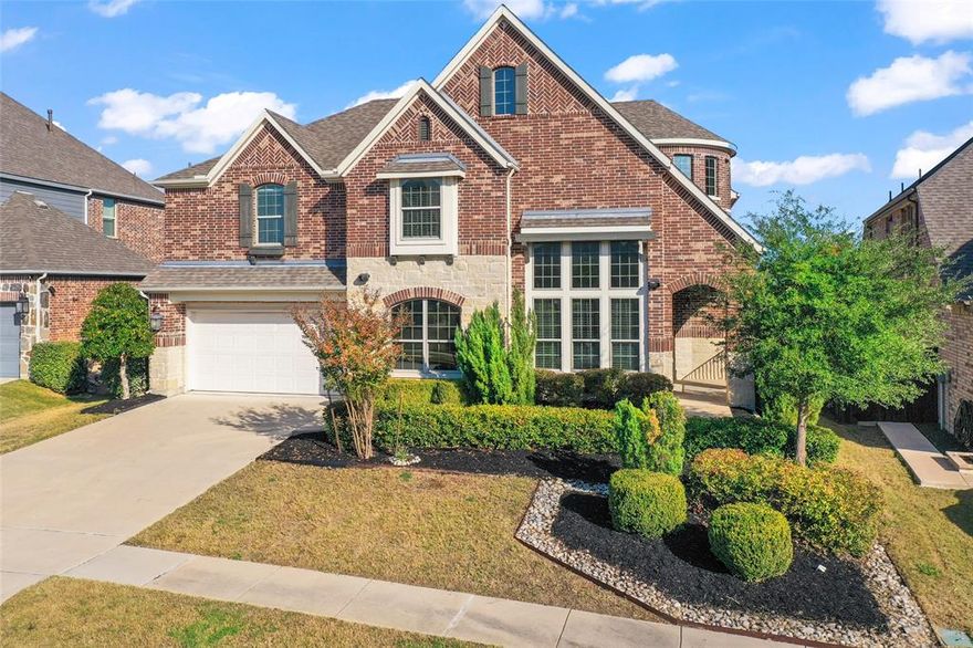 Beautifully refreshed former Meritage model home in the highly sought-after Trinity Falls community. Experience the benefits, look, and feel of a new build, complete with elegant builder upgrades and refined finishes, without the wait or the premium price of a new build. This two-story stunner offers 4 bedrooms, 3.5 baths, a dedicated flex space, media room, game loft, oversized garage, blending thoughtful design with modern comfort, a functional layout that offers ideal space and separation. 

This home features abundant natural light, complemented by two-inch window blinds, sophisticated recessed lighting, modern chandelier fixtures, and ceiling fans in all bedrooms. Each bedroom also has a walk-in closet for added comfort and style.

Step inside to find freshly painted interiors, new premium patterned carpet, and a newly stained staircase that enhances the home’s elegant feel. The open-concept floor plan centers around a gourmet kitchen with double ovens, a spacious granite island with storage, KitchenAid appliances, and a walk-in pantry, perfect for cooking and entertaining.

Enjoy 10 in-wall speakers with custom trim frames, built-in cabinetry, a desk, a storage area off the laundry room, and an epoxy-coated garage floor with extra storage area. The primary suite on the main level offers a luxurious retreat, complete with a garden tub, separate walk-in shower, and oversized closet. Upstairs, two of three bedrooms share a Jack-and-Jill bath, with a third stand-alone full bath, and versatile media and loft spaces perfect for a variety of living or entertaining needs.

Energy-efficient features include double attic insulation, a tankless water heater, and smart-home prewiring for comfort and savings. Located within McKinney ISD and minutes from Highways 75 and 380, enjoy resort-style amenities, two community pools, lakes, scenic trails, clubhouse, fitness center, dog park, and more. It's an in-person must-see. Schedule your private tour today!