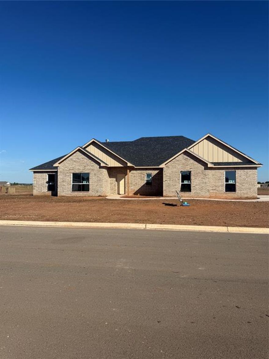 Stunning new build by Wilson Built Homes in the heart of Jim Ned ISD, situated on a spacious half-acre lot. This thoughtfully designed 4 bedroom, 2.5 bath home includes luxury vinyl plank flooring throughout for a clean, upscale look with durability in mind. The open concept living area with a corner wood burning fireplace, flows into a beautifully appointed kitchen with quartz countertops, electric cooktop, wall oven and microwave, dishwasher, and a walk-in pantry. The primary suite offers a private retreat with dual sinks, soaking tub, separate shower, and a walk-in closet. A well-equipped laundry room includes a utility sink, and there's a convenient mudroom entry from the 2-car attached garage. The Guest Wing includes 3 bedrooms, a full bathroom with dual sinks, tiled tub-shower combo, and a linen closet, offering comfort and privacy for family or visitors. Enjoy outdoor living with a 6’ privacy fence in the backyard, and a front yard package that includes sod, sprinkler system, flower beds, and two trees.