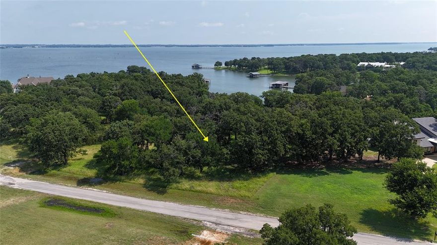 Create your custom lakefront masterpiece on this exceptional 1-acre waterfront lot in The Woods at Richland Chambers, one of the lake’s most desirable and naturally beautiful communities. Gently sloping and richly wooded with mature hardwoods, this property offers privacy, filtered water views, and multiple ideal building sites surrounded by nature. Positioned along a quiet, protected canal with access to the main body of Richland Chambers Lake, the lot provides a tranquil setting while still delivering outstanding boating, fishing, and recreational opportunities. The calm canal frontage is ideal for a future private dock (permit required), allowing seamless access to open water without sacrificing serenity. This property features utilities already installed, generous road frontage, and an all-weather asphalt county road, making it well-suited for a seamless custom build. Thoughtful deed restrictions and site-built home requirements help preserve the quality, value, and architectural integrity of the neighborhood. Surrounded by abundant wildlife and the peaceful sounds of the outdoors, this lot offers a rare combination of wooded seclusion and waterfront living. Whether envisioned as a refined weekend escape or a full-time luxury residence, this property provides an extraordinary opportunity to build in an established lake community known for its beauty, privacy, and relaxed elegance.

Richland Chambers Lake is celebrated for its wide-open water, scenic shorelines, and world-class fishing—making this an ideal setting for an elevated lake lifestyle.