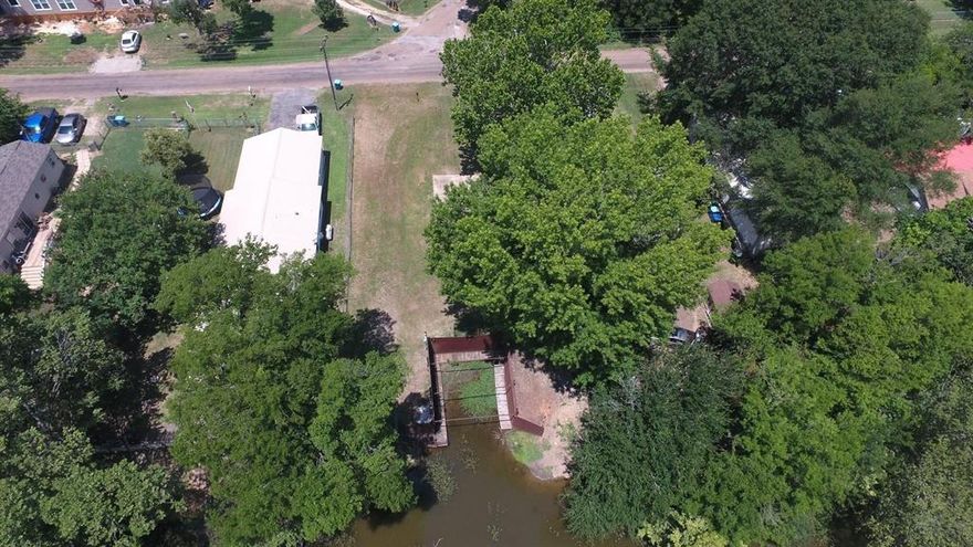 Vacant lot ready for a New Home or a Manufactured Home. Lot is cleared and sit on a channel and is just a few lots down from the community boat launch. Property features a boat slip that is a must see. Boat slip is made of metal and can made to be a double decker for your summer get togethers. This property is located just minutes to shopping, dining and all the lake activities. The community has a pool, playground, park, fishing pier and boat ramp.