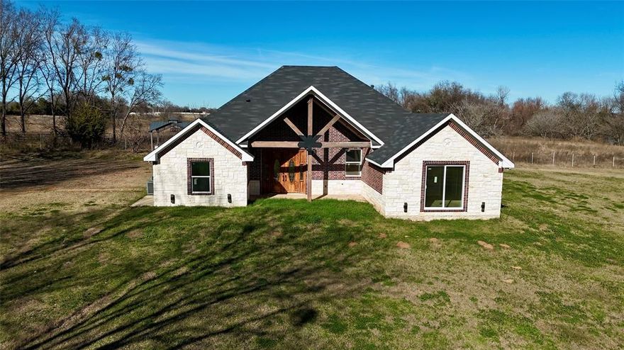 Approximately 80% completed, this 4 bedroom, 2 bath home sits on a beautiful 2.5 acre lot and offers an excellent investment or custom finish opportunity. Construction began in 2023, allowing the next owner to complete final selections and add personal design touches.

The home features an open layout, vaulted ceilings, and a flexible front room ideal for an office or formal living space, complete with two closets. Spacious bedrooms and a functional floor plan provide comfort and versatility throughout.

Enjoy outdoor living with a covered patio n porch, front gated entrance, and a designated outdoor kitchen area, already set up and ready for a grill perfect for entertaining and family gatherings. With no known restrictions, the expansive acreage allows room for additional improvements such as a pool, workshop, or recreational space.

The property is equipped with two HVAC systems for efficiency, a 2 ton unit serving the primary suite and a 3.5 ton unit for the remainder of the home. This property presents a great opportunity for buyers looking to finish and customize a home to their vision. There is not an updated survey, if one needed it will have to be at buyer expense.