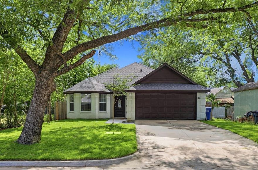 Beautiful and completely remodeled home in the heart of McKinney, blends modern updates with timeless charm. Recent improvements include foundation work, freshly painted white brick exterior, a new black roof and new grass in both the front and backyard for beautiful curb appeal.
Inside, you’ll find a light-filled, open layout complemented by new laminate flooring throughout—no carpet—and fresh white paint that enhances the home’s clean, modern feel. The kitchen is a true standout, featuring white cabinetry, quartz countertops, a striking navy backsplash, all new black hardware and fixtures and new appliances. Updated lighting and modern fixtures are found throughout, along with ceiling fans in every bedroom & new blinds were recently added to all windows. The spacious living area flows seamlessly into the dining and kitchen spaces, ideal for everyday living and entertaining. The private primary suite offers a relaxing retreat, while secondary bedrooms provide flexibility for guests, a home office, or additional living space. Both bathrooms have been fully remodeled with new toilets, tubs, tile, mirrors and faucets, delivering a cohesive, updated design. Step outside to a generous backyard complete with a covered patio and built-in grill and kitchen area with electric connections—perfect for hosting or enjoying quiet evenings outdoors. Ideally located just minutes from Historic Downtown McKinney, with convenient access to dining, shopping and local events, this move-in ready home offers style, comfort and an unbeatable location. Come see today!