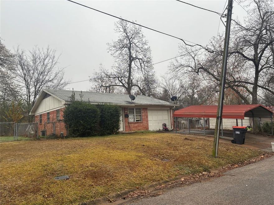 Brick house on slab; 2 bed,  2 bath , 2 Living area home with detached carport.