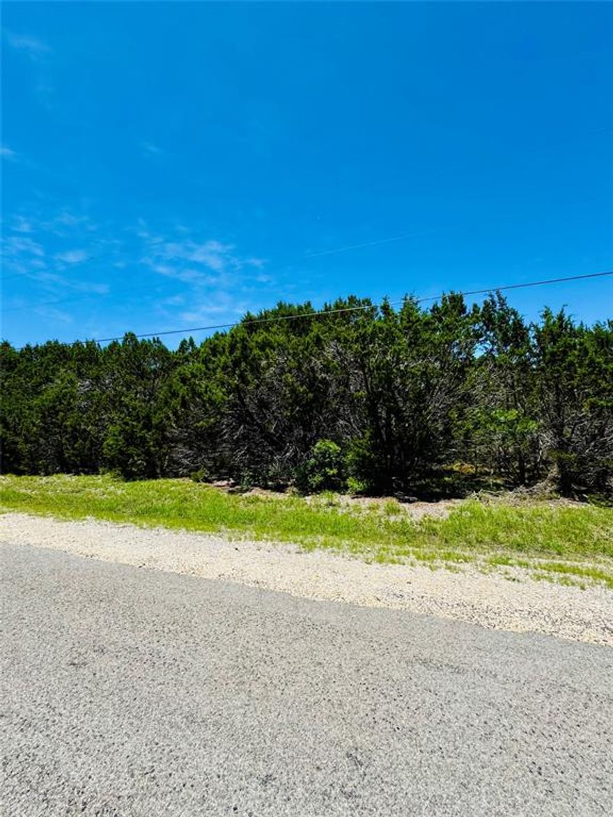 This beautiful property is located in White Bluff Resort. White Bluff is the place to be. Nestled within a secure gated community, White Bluff Resort boasts the breathtaking Lake Whitney, known as one of Texas, most picturesque lakes. Indulge in the resort's exceptional amenities, including two 18-hole golf courses, four swimming pools, enticing restaurants, tennis courts, playgrounds, parks, marina, volunteer fire department, conference center, and even a hotel. All amenities transfer with sale of property. 36 rounds of golf a year come, excluding cart come with the property. Deer and wildlife add to peace and serenity that are unique to this RELAXED RESORT LIFESTYLE.