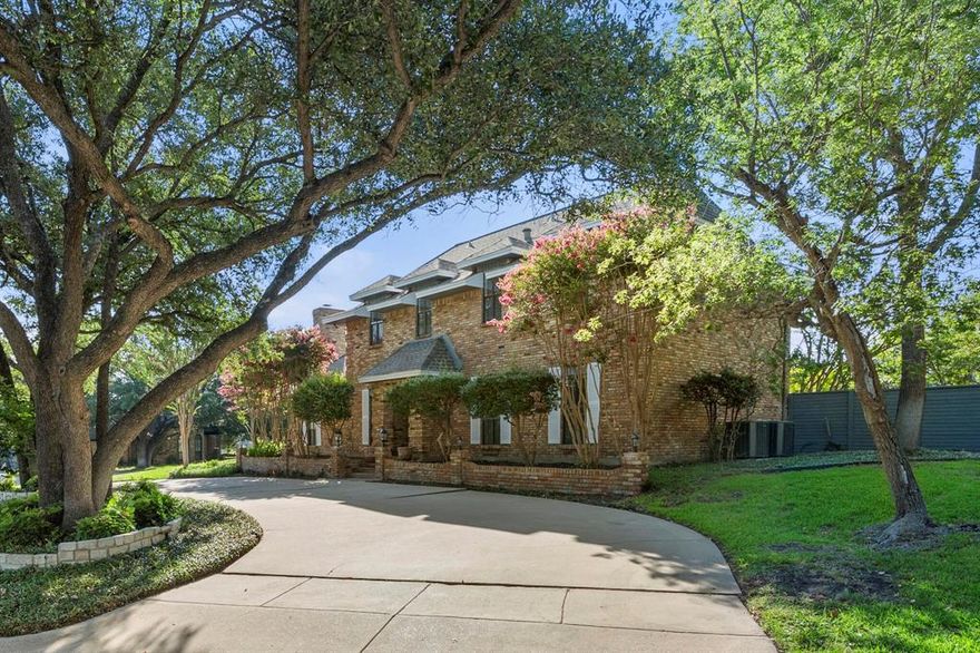 Elegant TCU-Area Retreat with Modern Upgrades 10 minutes from TCU.  Experience timeless charm and modern comfort in this beautifully updated two story residence, perfectly situated just 10 minutes from TCU on a serene cul-de-sac. Set on a generous 0.3-acre lot, this home offers an ideal blend of elegance, functionality, and privacy.

Step inside to discover inviting living spaces designed for both relaxation and entertaining. The main level features a warm den with rich wood paneling and a classic wood-burning fireplace, complemented by a spacious living room and a formal dining room. The chef’s kitchen boasts granite countertops, custom built-ins, abundant storage, and a bright breakfast nook overlooking the backyard.

Upstairs, retreat to the luxurious primary suite, complete with space for a sitting area, custom cabinetry, a private deck, and a second fireplace for cozy evenings. The spa-inspired ensuite features a soaking tub, separate shower, and generous walk-in closet.

Additional amenities include a circle drive for convenience, gated rear parking, and a garage with a finished workshop space. With thoughtful updates throughout and exceptional attention to detail, this home offers a rare opportunity to enjoy comfort, character, and sophistication in one perfect setting.