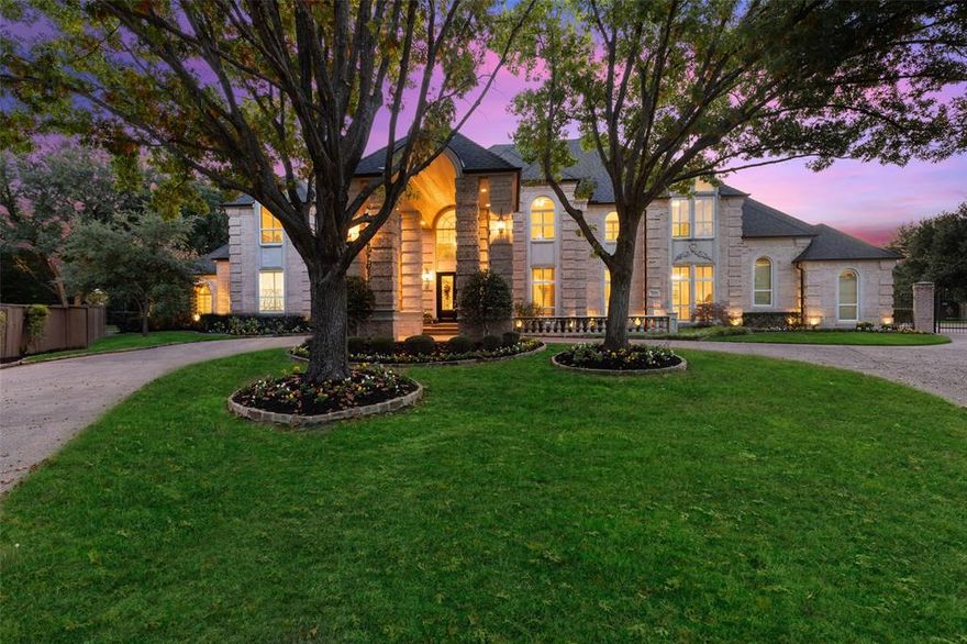 Magnificent Southlake home, brimming with elegant architectural and design touches. Breathtaking entry, bathed in natural light, leads to spiral stair with intricate iron balustrade and arched passage to main living with towering ceiling, two-story windows, and regal stone fireplace. Additional spacious living area up, with vaulted ceiling, built-ins, and balcony overlooking backyard. Wonderful kitchen, open to adjacent family room and breakfast area, featuring gorgeous wood cabinetry, built-in stainless appliances, island with cooktop and 2nd sink, and adjoining butler's pantry. Richly appointed office with opulent wood paneling and built-ins. Sumptuous main bedroom with recessed ceiling, sitting area, fireplace, private backyard access, and luxurious en suite with jetted tub, separate block glass shower, dual vanities, and makeup counter. Private backyard retreat with covered patio, mature trees, stone walkways, and dazzling saltwater diving pool with waterfall and spa.