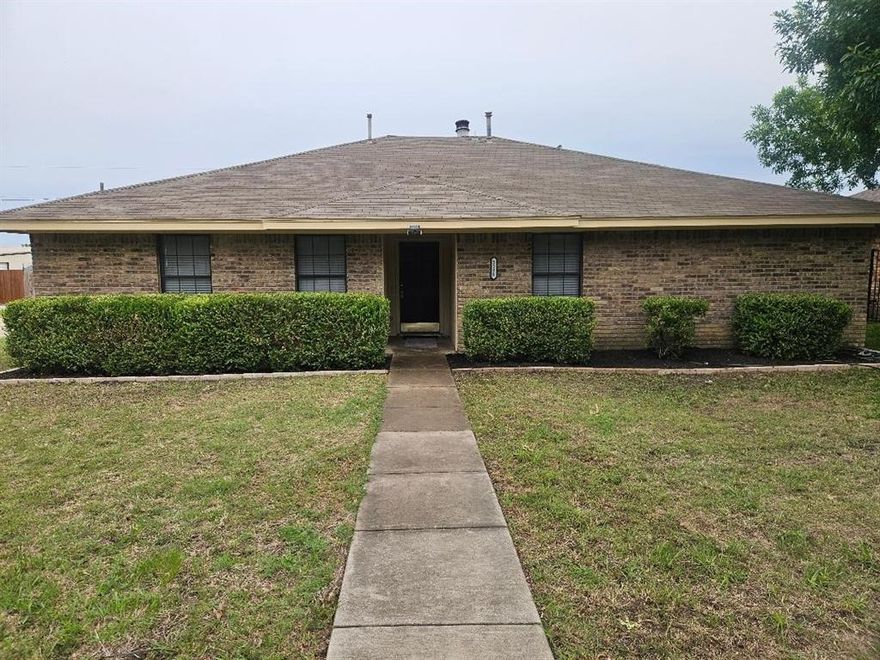This updated traditional Suburbia home in Sachse, offers a large living room with a brick wood burning fireplace, and vaulted ceiling open to Breakfast area and Kitchen. Kitchen features plenty of cabinetry with a built-in Microwave, an Electric range, pantry and access to full size washer dyer area.  Spilt bedroom floorplan, ceiling fans, 2-inch faux wood blinds, and all walk-in closets. French doors lead to open patio and private yard with new wood privacy fence. Three miles from Firewheel Town Center and George Bush Tollway. Freshly painted including all cabinets, new carpet, two new bedroom ceiling fans, resurfaced tubs with 5-year warranty, and new cabinet knobs. New door stops, new smoke detectors, new toilet seats, some new bathroom accessories and plumbing fixtures. HVAC new January 2020. HW Heater new September 2024