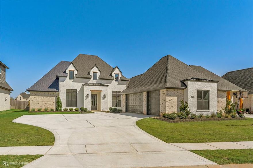 Absolutely gorgeous new construction home in gated Canal Place! This 2754sf home is all on one level and designed with flexibility in mind - whether you need a private retreat or an entertaining paradise, you're sure to fall in love. The professional landscaping and tasteful mix of white and natural brick offer immediate curb appeal. As you step inside, you'll notice the wide-open floor plan with abundant natural light and great attention to detail throughout. The crown molding and modern fixtures bring elegance while the wood-look tile offers convenience without sacrificing style. The gourmet kitchen features stainless appliances, a large pantry, and stunning center island - sure to make any meal a breeze. The primary suite is a true retreat with enough room for a sitting area and spa-like ensuite bath complete with soaking tub and tiled shower. The three additional bedrooms offer space for family, guests, or maybe a dedicated home office while the two additional full baths ensure privacy and convenience for everyone. Outside, you'll love spending time in the sun with the large back patio perfect for hosting summer BBQs and room to add a fire pit or even a pool! Don't wait, schedule your private tour today!