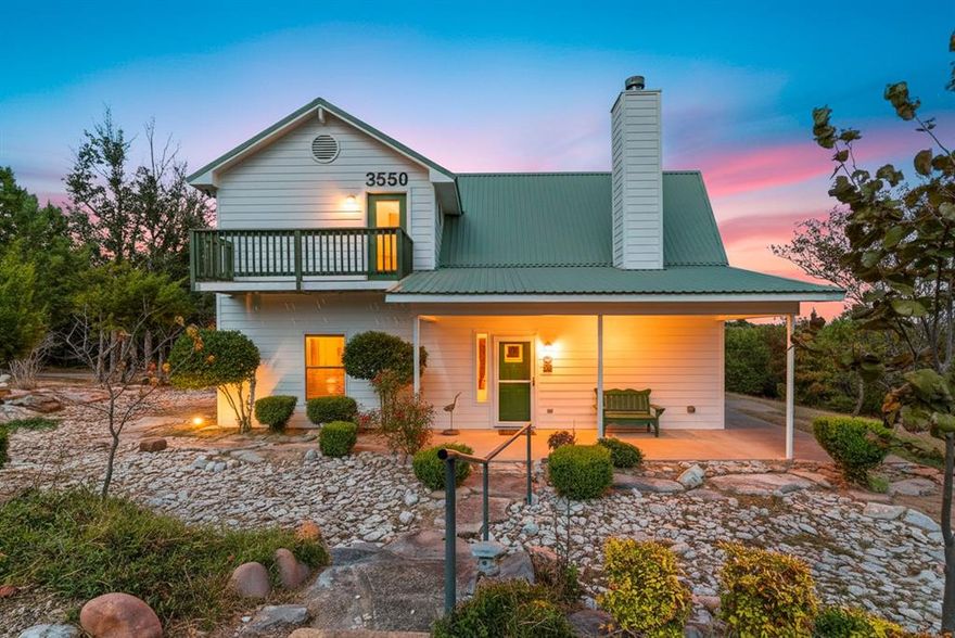 Welcome to this wonderful 2 story home sitting on 1 acre with landscaping and beautiful views that the hill country of Bluff Dale, Tx provides. This 3 bedroom has 2 full baths and offers a quaint office with fantastic views and convenient utility room.  Enjoy the open concept kitchen, dining and living area with it's high ceiling and boast a cozy wood burning fireplace, from the landing on the second floor make a book nook and enjoy the view.  The fabulous wall of windows show off the great outdoors and wildlife that call this and neighboring properties home.    Newly paved driveway leading to the double carport holds a nice 22'x11.7 workshop or use for additional storage.  Enjoy the sunsets and mornings on the balcony or under any of the porches.   Bring your personal touch and call this property home.  This you will want to see.