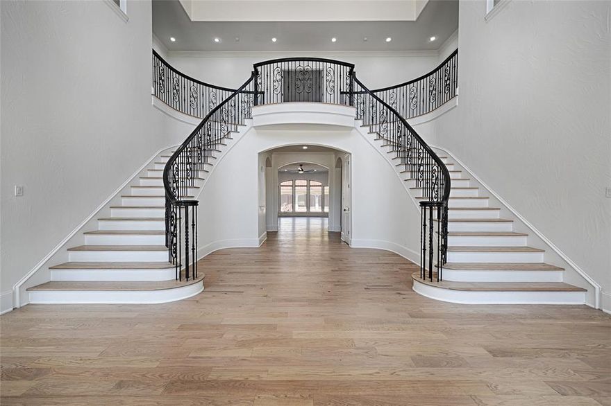 Step into this fully updated luxurious residence on a large corner lot in the heart of North Dallas where chic and elegance meet. Upon entry you will be greeted with vaulted ceilings and an exquisite grand double staircase. Inside a welcoming dining and living area enhanced with natural sunlight welcome you and seamlessy flow into the kitchen. The study is enhanced with built in shelving and equisite moldings.  The heart of this home, the kitchen, includes stainless steel appliances a 6 range Wolf stove top, warming drawer, double oven, double sinks, double dishwashers, a pot filler and an oversized pantry making it a chef's dream.  Enjoy the elegance of hardwood floors throughout the main areas of the home creating a warm and inviting atmosphere. Primary suite located on the first floor is a retreat with a spa like bathroom and spacious closets including cedar closets.  Second story includes 3 bedrooms each with an en suite bathroom,  a media room, game room, and a charming balcony overlooking the backyard. The circular drive compounded with the 4 car garage allows for ample parking and storage. House is located in a sought after private school corridor, near the Cooper fitness center, and close to shopping, dining, and transportation.