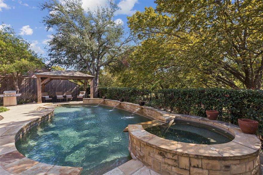 Experience resort-style living in this beautifully updated north-facing 5-bedroom, 4-bath home featuring a private heated pool and spa in the highly desirable Creekside community. Step inside to discover soaring ceilings, a grand staircase, and a bright, airy interior highlighted by NuCore® LVP flooring, plush carpet, and fresh interior and exterior paint in modern, neutral tones. Enjoy complete peace of mind with extensive 2025 upgrades, including a TAMKO Titan XT® roof with Z-Ridge caps, seamless gutters, and four HVAC systems — two Puron units (2025) and two well-maintained 410 systems providing zoned comfort throughout the home. The EnergyCore™ R6 windows (2023) — several triple-pane on sun-facing sides — offer superior insulation, noise reduction, and energy efficiency, keeping the home cool and electricity bills low even in peak Texas summers. The chef’s kitchen is perfect for both entertaining and everyday living, featuring premium KitchenAid appliances, dual microwaves, and dual sinks. Step outside to your private backyard oasis, surrounded by mature trees and highlighted by a 16’x12’ gazebo and a sparkling heated pool and spa — the ideal space to unwind or host family and friends. Additional highlights include a 3-car garage with built-in cabinets, overhead storage racks, and a walk-up attic, plus a monitored smart security system with exterior cameras for added peace of mind. Located just minutes from George Bush Turnpike, Dallas North Tollway, and Hwy 121, and within walking distance to Hebron High School and Prestonwood Christian Academy, this home offers the perfect combination of comfort, efficiency, and convenience in one of Carrollton’s most desirable neighborhoods. A residence that truly blends modern upgrades, energy efficiency, and timeless comfort