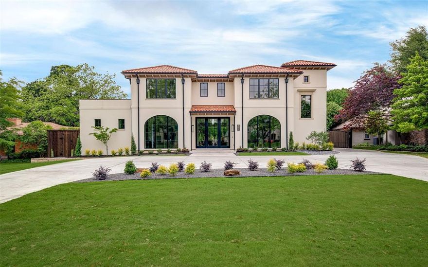 Experience timeless elegance and modern luxury in this Santa Barbara-style new construction by Conifer Homes, nestled in the coveted Forest Hills neighborhood of Dallas. Thoughtfully designed for refined living and effortless entertaining, this custom residence boasts striking curb appeal and a light-filled interior with clean lines and natural textures. Floor-to-ceiling windows in the living room offer stunning views of the pool and spa, anchored by a custom Isokern fireplace with sandblasted marble surround. The chef’s kitchen features quartzite countertops, an eat-in island, Sub-Zero refrigerator-freezer, dual Cove dishwashers, 60-inch Wolf gas range with double ovens, and a 146-bottle Sub-Zero wine fridge. The adjacent service pantry includes custom cabinetry, a Miele warming drawer, microwave, and ample appliance storage, while the wet bar offers a sink, wine fridge, and Scotsman ice maker. A formal dining room and office—both with floor-to-ceiling windows—sit off the entry. The office is finished with a built-in desk and cabinetry for a seamless work-from-home setup. The downstairs primary suite is a private retreat with views of the pool, dual closets, separate vanities and toilets, a large walk-in shower, and soaking tub. Upstairs are three ensuite bedrooms, a study with two built-in workstations, a game room with full bath and beverage fridge, and a secondary utility room. Enjoy a beautifully landscaped yard, motorized screened patio, outdoor fireplace with decorative tile, and built-in Coyote grill. The gated drive leads to a three-car garage with epoxied floors. Home includes 2 half baths, is elevator ready, and features Lutron lighting and built-in speakers.