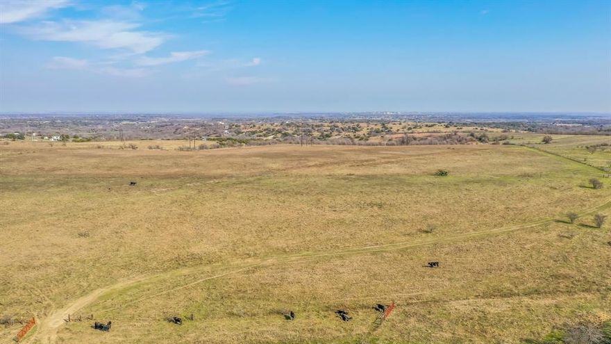 67 Rolling Acres with exceptional views never before offered for sale! Experience breathtaking sunrises and panoramic hilltop views stretching all the way to the downtown Fort Worth skyline. This remarkable property has been lovingly preserved by the same family since the 1880s and is now available for the first time. With a perfect blend of level and rolling terrain, the land offers exceptional build sites, whether you dream of a luxury estate, an equine facility, a working cattle ranch, or a thoughtfully designed development. Open prairie pastures, a pond, striking rock outcroppings, and a meandering creek with crystal clear water create a picturesque landscape full of character and adventures. Located just minutes from downtown Weatherford, this rare offering provides both convenience and tranquility. There aren’t many places this close to town where you can stand in complete stillness and hear nothing but nature. Don't miss this extraordinary opportunity to own a piece of history and shape your own legacy in this stunning setting.