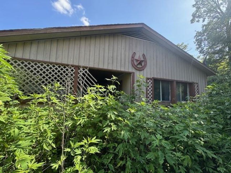 This charming home is a blank canvas awaiting your personal touch. Nestled on a quiet and secluded 3 acre lot with mature trees, this property offers plenty of space and privacy with no HOA. The home includes a fridge and stove. This home is a fantastic opportunity to create your dream space in a peaceful country setting.