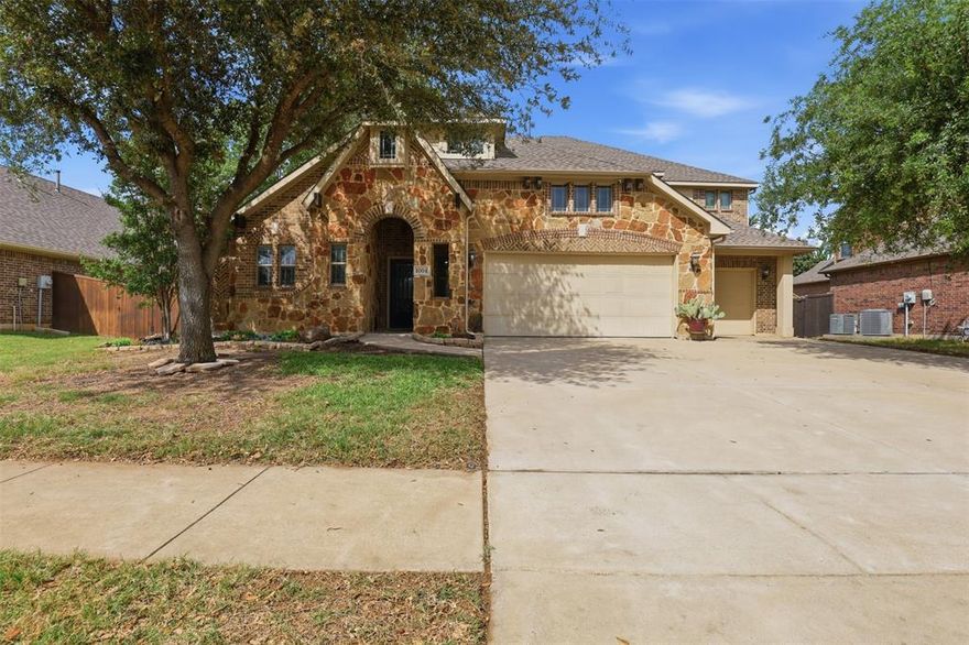 Welcome to the highly sought-after Plantation community where comfort, convenience, and community come together. With access to a neighborhood pool, scenic walking trails, playgrounds, and top-rated schools, this home is perfect for a growing family or multi-generational living, all with easy access to I-35 and the DFW metroplex.
The stone-accented exterior and inviting front porch lead into a grand foyer with soaring ceilings and hand-scraped hardwood floors throughout the main living areas. Natural light fills the open-concept layout, highlighting the spacious living and dining areas, ideal for everyday living and entertaining. The flexible floor plan features a private home office or optional 5th bedroom, plus two additional bedrooms connected by a full bath on the main level. Fresh carpet adds a clean updated feel. A mudroom and laundry area with built-in storage and drop zone provide everyday functionality, along with a convenient powder bath. The oversized kitchen is a standout, offering granite countertops, freshly painted cabinetry, newer appliances, a walk-in pantry, and a large island with prep space. The expansive eat-in area flows seamlessly to the outdoor living space. Enjoy the covered patio and unique electrified she-shed, cabana with extra storage, perfect for a workshop, studio, or retreat. The backyard is ready for relaxing or entertaining. The spacious primary suite offers room for a sitting area and features a luxurious ensuite with dual vanities, soaking tub, separate shower, walk-in closets, and private water closet. Upstairs includes an additional bedroom, full bath, large game room, and dedicated media room, plus easy attic access for extra storage. Located near shopping, dining, and entertainment in Burleson and surrounding DFW areas, this home offers space, flexibility, and a true sense of community.
