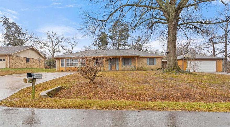 10130 Brookwood Drive in Tyler offers space, flexibility, and room to grow. This 3 bed, 2 bath home sits on three combined lots totaling just over ¾ of an acre, providing plenty of room for additional buildings, workshops, or even a potential secondary residence. Inside, the home features a large kitchen and dining area along with a cozy fireplace that anchors the main living space. A 2 car garage adds convenience, while the real standout is outside: three separate shop buildings, perfect for projects, storage, hobbies, or business use. The property is surrounded by mature trees, offering privacy and a peaceful feel, while remaining close to town and everyday amenities. Out back, you’ll find two covered porch areas, making it easy to enjoy the quiet setting year-round. This is a rare opportunity for buyers looking for land, shops, and flexibility without sacrificing proximity to Tyler. Call to schedule your showing today!