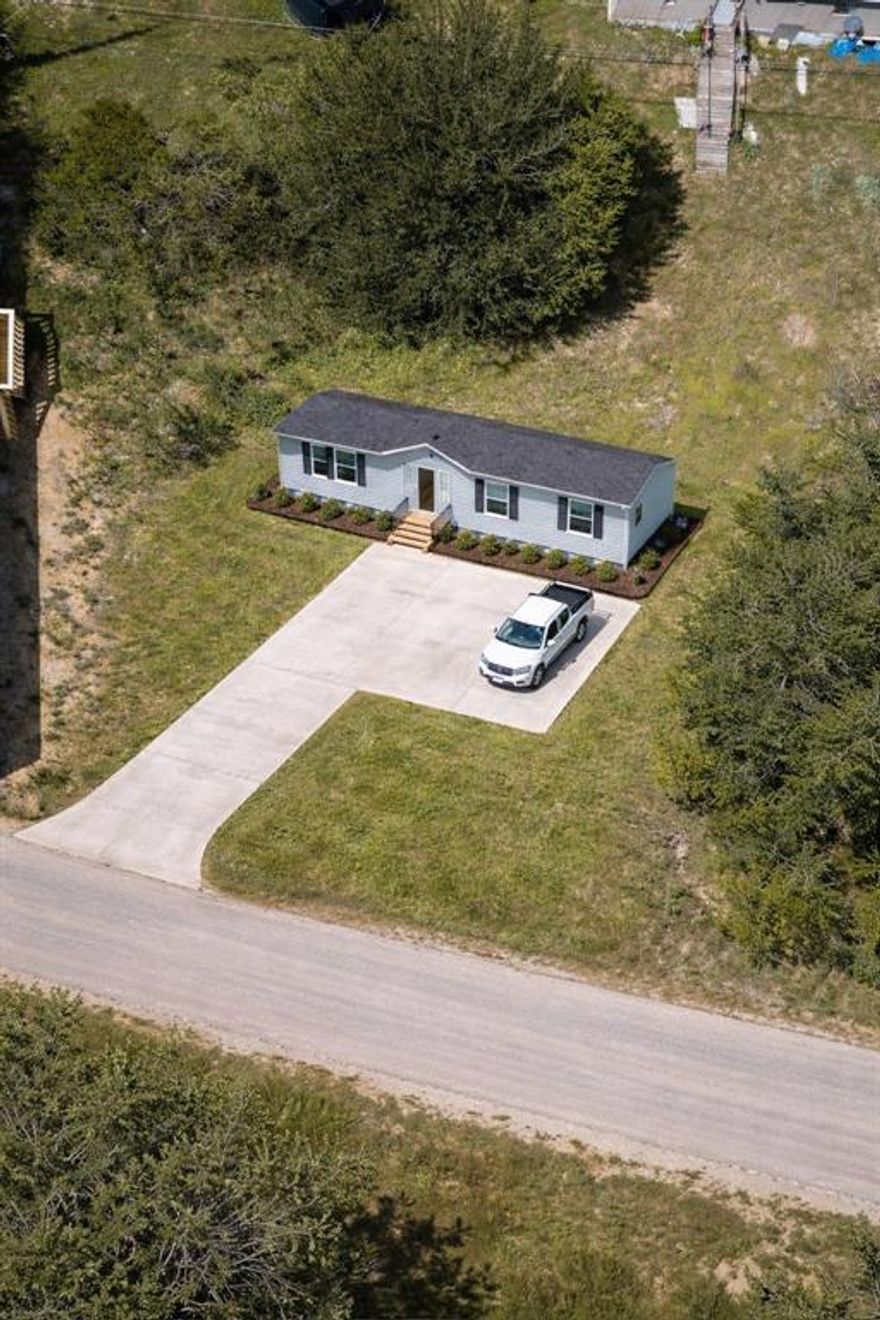 Vacant Lot, great opportunity to own a piece of land in the Lake Granbury Harbor community! Nestled in a peaceful neighborhood near Lake Granbury, this lot offers a blend of country charm and city convenience. Low HOA fees and light restrictions make it ideal for building your next home. This level lot is ready for your future home, weekend retreat, or investment property. Located just minutes from the historic Lake Granbury Square, you’ll enjoy easy access to local dining, shopping, and entertainment.  ANY Photo's displaying a home are an Artistic Concept and there is no Home on the property. Seller nor listing agent Do Not have blueprints or designs since this is an Artistic Concept of the possibilities that could be possible with this property.