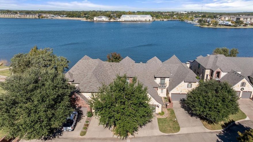 Waterfront Luxury Living at its best!!!
Welcome to this stunning 2-bedroom, 2.5-bath waterfront home perfectly situated on the highly sought-after Lake Granbury. From the moment you arrive, the elegant brick and stone exterior, manicured landscaping, and private drive set the tone for the timeless beauty that awaits inside.
Step through the entryway into a bright, open-concept living space featuring large windows that frame breathtaking panoramic lake views. The living room flows seamlessly into a spacious dining area and gourmet kitchen — perfect for entertaining or quiet evenings by the water.
The primary suite offers a serene retreat with tranquil lake views, a spa-inspired bathroom, and generous closet space.  Additional bedroom, family room, bonus room and a second full bath, on the second floor, provide comfort and flexibility for guests or family.
Outdoors, you’ll love the expansive stone patio overlooking the water, ideal for morning coffee, sunset gatherings, or hosting lakeside dinners under the trees. The property’s iron fencing and natural landscape create both beauty and privacy and incredible waterfront views.
Located just minutes from shopping, Downtown Granbury, and local dining, this home combines luxury, convenience, and unmatched views — a rare opportunity on Lake Granbury’s mainbody shoreline.