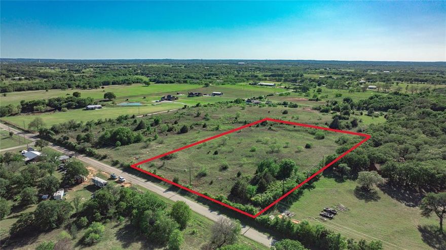Discover your own slice of Texas paradise with this exceptional 5-acre property located in the highly sought-after Springtown ISD. Tucked away among a canopy of mature oak trees, this land offers the perfect balance of seclusion and accessibility, providing a peaceful retreat while still being close to schools, shopping, and conveniences. The property’s natural beauty is unmatched—towering oaks create a serene, shaded landscape, while open spaces invite endless possibilities for building your dream home, adding a barn, or creating a private garden oasis. As the day winds down, you’ll be treated to sunset views that spill golden light across the horizon, creating a picture-perfect backdrop for evenings spent outdoors. At night, the clear Texas skies reveal a dazzling display of stars, making this an ideal setting for quiet reflection or gatherings under the open sky. Whether you envision a rustic homestead, a modern country estate, or a weekend getaway, this property offers the space, privacy, and natural charm to bring your vision to life.