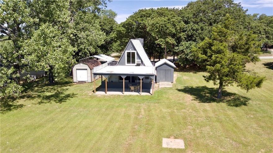 Set on the 7th fairway of the highly sought-after Lake Kiowa Golf Course, this A-frame bungalow offers more than just a charming home—it offers a vision. Whether you’re looking to create your ultimate golf retreat, a weekend escape, or expand with the purchase of the adjacent lot, the potential here is as wide open as the fairway views. The home itself has received a fresh update, including newly painted walls, floors, ceilings, and fireplace brick, as well as a fully repainted exterior. Energy-efficient windows and doors bring modern comfort, and a new dishwasher, refrigerator, reimagined fireplace, and updated bathrooms complete the space. A covered patio overlooking the course provides a peaceful spot to enjoy your morning coffee as the sun rises or watch golfers make their way to the green. But the true value lies in location and lifestyle. Lake Kiowa is a private, guard-gated lake and golf community where residents enjoy a wide variety of resort-style amenities. Launch your paddleboard, boat, or jet ski from the community boat ramps, spend weekends fishing on the private lake, or relax on one of the sandy beaches. For land-based fun, enjoy tennis, basketball, or the community’s brand-new pickleball courts coming soon. Golfers will love the 18-hole championship course as well as the upcoming par-3 course—perfect for quick rounds or sharpening your short game.