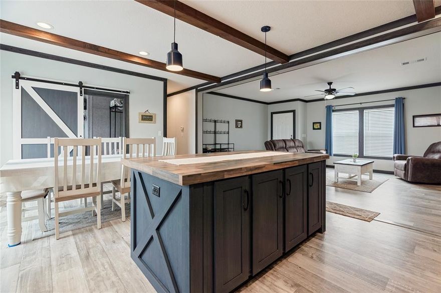 Pride of ownership shines through in the well maintained manufactured home, set on a permanent foundation with tie-downs and full skirting- ready to qualify for traditional financing. Owned by the original owners, this home offers peace of mind and thoughtful care throughout. It has 3 bed, 2 bathrooms and bonus living area that could be used as a 4th bedroom. Situated on a spacious 1-acre lot with privacy fence, this property provides room to roam while offering a sense of seclusion. Enjoy the outdoors from both the front and back decks-perfect for relaxing or entertaining. Additional features include an RV-hook up, ideal for guests on your won travels. Solar panels are included, which drastically reduced the electric bill year round. Whether you're looking for a full time residence or a country retreat, this blends comfort, functionally, and space-all at a great value.