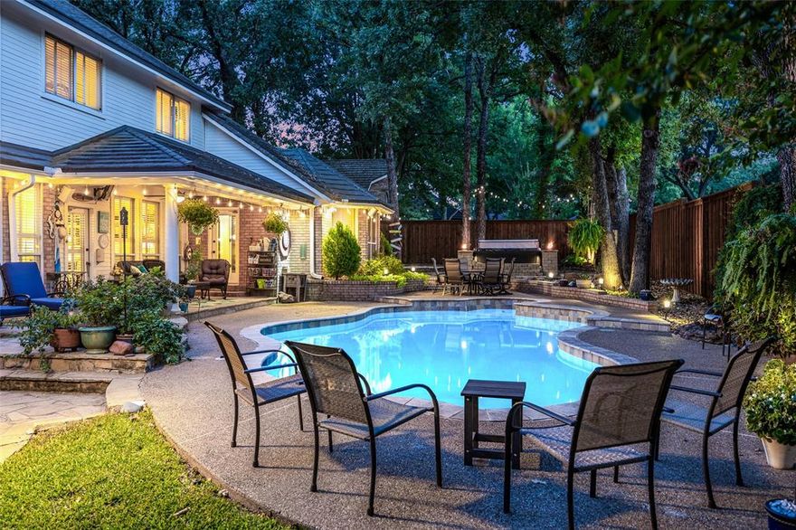 This exquisite home offers undeniable curb appeal with beautifully landscaped grounds, a stately circle drive, and a charming covered front porch that welcomes you in. Nestled on a lush, tree-lined lot, the property boasts a perfect blend of luxury, comfort, and functionality. Step inside to soaring ceilings in the grand entryway, elegant wood flooring, and a wrought iron staircase that sets the tone for the rest of the home. The formal living room features a cozy fireplace, while the adjacent formal dining area provides an ideal space for entertaining. A wet bar adds an extra layer of sophistication for hosting guests. The heart of the home is the spacious kitchen, designed with the home chef in mind—featuring an oversized island, abundant cabinetry, gas cooktop, and double ovens. Built-ins in the casual dining area offer both charm and convenience. The family room includes a second fireplace and views of the backyard oasis. The luxurious primary suite is a serene retreat with plush carpet, a spa-inspired bathroom that includes an oversized walk-in shower, large soaking tub, dual vanities, generous storage, and a spacious walk-in closet. A private guest suite with its own bathroom ensures comfort and privacy for visitors. The large utility room and additional storage spaces throughout the home add practicality without sacrificing style. Outdoor living is a dream with a built-in grill on the expansive back patio, offering both covered and open-air lounging spaces. Relax by the in-ground pool, unwind in the hot tub, grab a game of darts or a game of washers in the sand washer pit, or gather around the backyard firepit. Additional features include a balcony overlooking the scenic yard, a 2-car garage plus 2 additional covered parking spaces.See Transaction desk for a full list of upgrades. 15 minutes to Tierra Verde Golf Club.