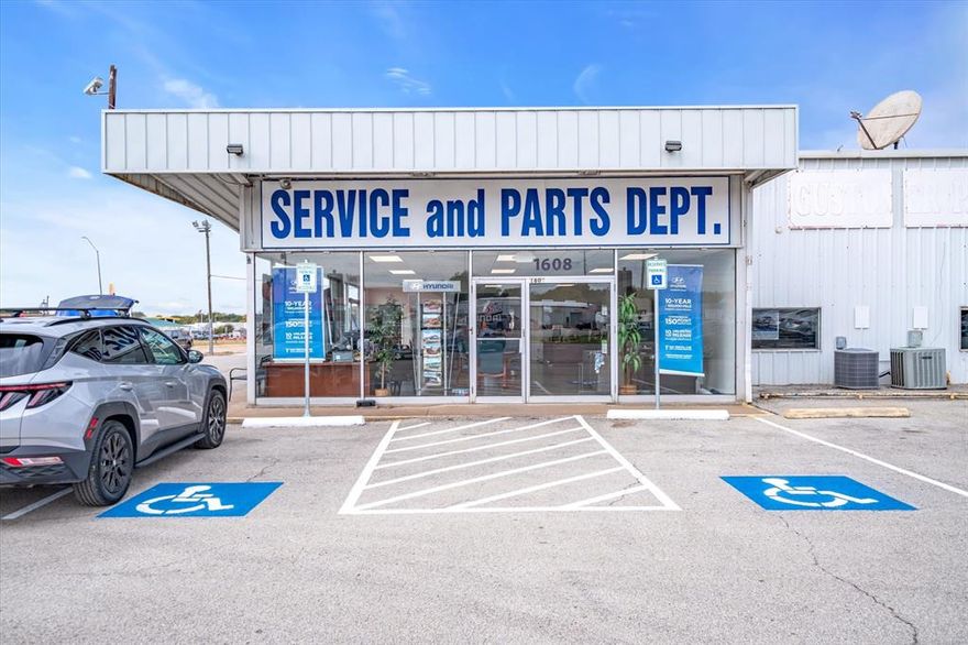 Located in Opportunity Zone: Occupied by a new car dealership in Terrell, just 30 miles east of Dallas, this property presents a lucrative opportunity. Ideal for car or equipment dealerships, distribution centers, or retail ventures, it is strategically located at the major intersection of SH 205 and US Hwy 80. The building offers a service bay, showroom, parts department, offices, and ample parking. Recently renovated, it meets all Certificate of Occupancy guidelines set by the City of Terrell. Situated at a major highway intersection, this property ensures prime visibility and accessibility in a thriving area.