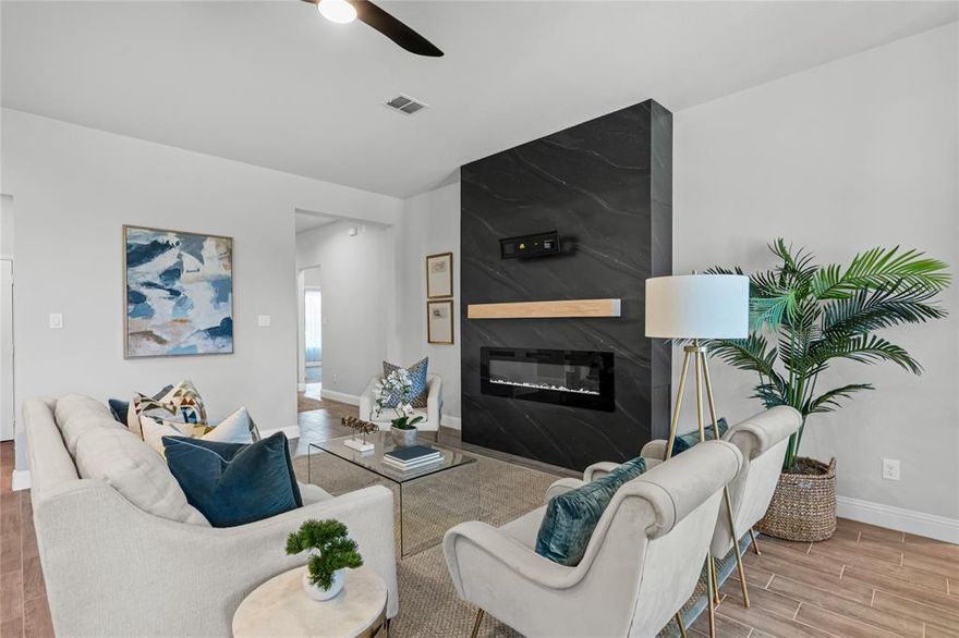 Seller is offering a Buydown for the Buyers Loan!!! Welcome to the community of Morningstar greeted by a beautiful lake that terraces down the south side of the neighborhood.  You will see home owners fishing, running and biking and enjoying their amenities.  There are 2 beautiful pools, basketball courts and playground equipment. 
The club house is awesome, one of the best master planned communities available in this area.  Built by Impression Homes in 2022, this home is like new, impeccable, very lightly lived in and move-in ready.   The home is staged so that you can see the livability and open floor plan designed for entertaining and family gathering.  A truly unique and beautiful focal point of the living room features a built in electric fireplace resting on a stunning black wall with a TV mount above the fireplace designed by the homeowner and also provides optional additional heat to the room. The house also has an additional larger covered patio area across the back giving you nice space for grilling or relaxing.  The home location is just 2 blocks from the new Elementary school.  The large primary bedroom features a bay window area proving a nice additional seating area. Morningstar, welcomes you with one of the most spectacular entrance of any neighborhood with a fishing lake, walking and bike paths, the pools and playground.   The MUD notice is in the transaction desk for review.