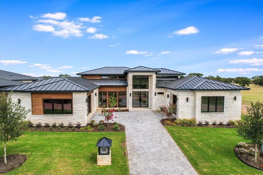 BEAUTIFUL. CUSTOM NEW CONSTRUCTION. EXCLUSIVE LOCATION. Included in the Villas of Applehead, this just completed modern transitional custom home by Crescent Estates Custom Homes exemplifies not only flexibility but luxury living at its finest. Built within the 24-hour guarded gated community of Applehead Island, you have access to the pickleball courts, tennis court, world class pool complete with entertaining facilities—without the outdoor maintenance of being on the water. The moment you open the oversized metal and glass front door you are greeted with white oak wide plank wood floors, a floor to ceiling fireplace adorned in porcelain tile, stylish contemporary lighting and amazing stone and tile work. There is a huge island adorned in a solid white quartz with room for 8 guests, to of the line Thermador stainless appliances and a stunning glass walled wine room visible to all the living and dining areas. The large kitchen also has a catering kitchen for use and storage that is not out in the entertaining areas. Don’t miss the laundry room complete with a designated dog wash area. The rooms in this single story masterpiece are very large and flow effortlessly. Living-dining- entertainment-lounge area- study or den or work out room off the pool and courtyard. The large sliding glass doors off of the living room are perfect for incorporating the inside and outside for entertaining or just relaxing. There’s even a putting green! The courtyard is within the yard that can be fenced for containing your pets and other outdoor living. The primary bedroom is truly a suite with access to the courtyard and pool and the primary bathroom is a must see! This home comes with a Developer paid initiation fees for a full Links Membership to The Horseshoe Bay Resort with approval of membership application. Come take a look today!