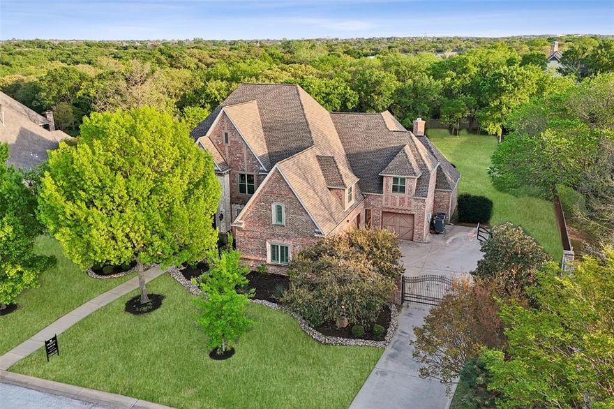 Nestled on a beautifully landscaped one-acre lot, this exquisite home offers the perfect blend of sophistication and comfort. Thoughtfully designed with an ideal floor plan and exceptional attention to detail, this home showcases hand-scraped hardwood floors, tasteful updates, and timeless finishes throughout.  

The tranquil primary suite is a true sanctuary, featuring a cozy fireplace and a spa-like bathroom. The chef’s dream kitchen, equipped with premium appliances, seamlessly flows into the inviting family room, creating an ideal space for gatherings.  

For work and play, this home delivers—a private office with rich wood paneling, built-in desk, and bookshelves provides a distinguished workspace, while the deluxe game room with a full wet bar is perfect for entertaining.  

Step outside to a breathtaking backyard oasis, where a custom Claffey diving pool with sets the scene for relaxation. The covered loggia, complete with a gas fireplace, offers a warm and inviting space to unwind year-round. Plus, enjoy direct access to the Grapevine Lake hiking and equestrian trails right from the street, perfect for outdoor enthusiasts!