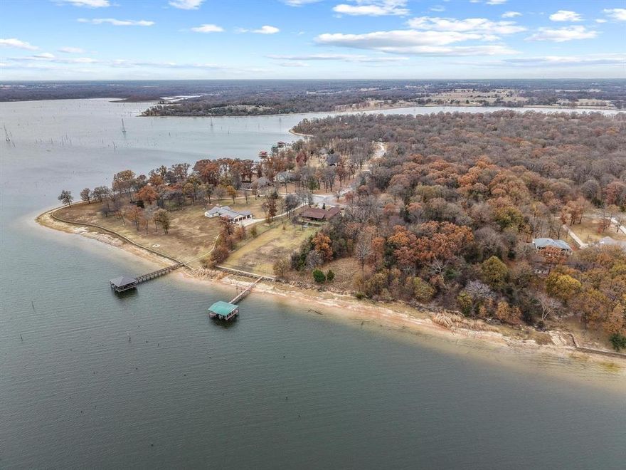 Located on the waters of Lake Fork, this exceptional 1-acre treed lake lot offers a rare opportunity to build in one of East Texas’s most desirable fishing and recreation destinations. Situated at Lot 15 RS County Road 3400, Emory, Texas 75440, the property lies within the Hillside Bay neighborhood. Mature trees provide privacy and create an ideal backdrop for a custom lakefront residence. The lot features approximately 200 feet of shoreline with deep water access, making it well suited for boating, fishing, and enjoying expansive lake views year-round.