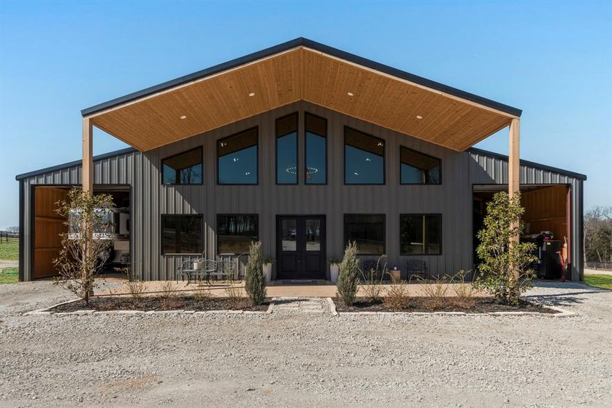 Welcome to luxury ranch living in Gainesville, TX where modern elegance meets country charm. This exquisite barndominium estate spans 3000 sqft. of meticulously designed living space featuring 4 bedrooms, 3 bathrooms, office, and upstairs living space, blending high-end finishes with rustic sophistication. The open floorpan is perfect for entertaining. Nestled on 11 ag-exempt acres, this property is a haven for equestrians, featuring sandy loam soil, a state-of-the-art 5700 sqft horse barn with custom stalls, tack room, and wash bay, 130x180 outdoor arena with two 40x60 attached pens. Mare motel features 4 additional stalls with turnouts. Storage on both side of the home, are perfect to store your trailer, RV, or ATVs. Separate RV hook ups are also available. Expansive no climb fenced pastures, and unparalleled privacy make this a rare North Texas gem. Whether you’re a horse enthusiast or seeking an upscale retreat, this ranch is a dream come true. *this property is NOT in a 100 year or 500 year flood plain*