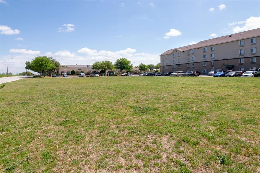 Property Highlights
Zoning: C-1C (Commercial) – Flexible zoning that supports retail, restaurants, offices, service businesses, and other commercial uses ideal for a new shopping center or mixed-use project.

Location: One block off Loop 820 (I-820) with high visibility and immediate access to one of Fort Worth’s primary beltway routes.
Surroundings: Multiple small commercial centers nearby already leasing space – proven demand and established commercial corridor.
Development Potential: Perfect for another retail or shopping center or virtually any buyer-driven concept – offices, medical, hospitality support, or creative mixed-use.

Market Access: Quick, easy drive to Downtown Fort Worth and the Dallas Metroplex. Strong regional connectivity via Loop 820, I-20, I-30, and I-35W.
This corridor is a proven commercial hotspot with active leasing in surrounding centers and strong demand for new retail and service-oriented space.

Ideal for Buyers Seeking Growth & Flexibility
Whether your vision is:

A new shopping center anchored by national or local tenants
Restaurant or retail pad sites capitalizing on hotel adjacency
Professional offices or medical space
Hotel-support services or creative mixed-use this C-1C-zoned site delivers the flexibility and location to make it happen. The surrounding small centers demonstrate strong leasing momentum and an established customer base ready for more options.

Why This Property Stands Out
High-Traffic Highway Proximity, Instant brand visibility and customer draw.
Hotel Synergy, Captive audience from day one. Proven Commercial Cluster ? Reduced risk – the market is already here.
Metroplex Connectivity, Attracts tenants and customers from Fort Worth, Dallas, and beyond.
Strong Local Market ? Fort Worth’s commercial sector continues to show solid demand for well-located retail and service properties.