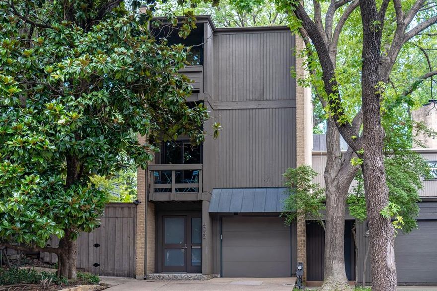 Check out this rarely available Frank Welch designed townhouse in Uptown. This unique townhouse has a large, private backyard viewable from each level of the home. Covered outdoor patios, walk-out deck & balcony on each level allow the owner to easily walk out and enjoy views of the lush garden & surrounding trees. The backyard flanked by the beige brick wall is a combination of green vegetation, molded concrete planters & blue river rock to create a tranquil place to relax in the middle of the bustling city. The house was recently updated with lightly stained hard wood floors, large bookcases on the first & third levels, coffee bar & new lighting. On the first floor is a bedroom or study and full bath with walk-out covered porch with dining table.  On the second floor a cozy living area with fireplace, kitchen & eating area. The second floor also has a walk-out balcony with sitting furniture to enjoy the exterior views. The third floor is all master suite. It has a fireplace, coffee bar with sitting area, huge book case, walk-in closet, bathroom with balcony overlooking Buena Vista. Come see this urban oasis half a block from the Katy Trail and 2 blocks from West Village. Truly this is a one-of-a-kind property.