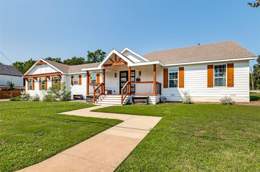 This home delivers a luxurious living experience. On a quarter acre corner lot, the property offers a spacious family room with an open-concept kitchen and dining room, perfect for modern living. Located in the heart of West Dallas, this stunning home is situated in a rapidly gentrifying neighborhood, just behind the historic Belmont Hotel. Plenty of room for a pool, gardening and room to grow - and yet so close to downtown Dallas. Upon entering, a covered porch leads to a gallery-like foyer, which opens up to the expansive living room with vaulted and beamed ceilings, creating a bright and airy atmosphere. The stylish kitchen features an island with sink, windows overlooking the front yard, and is seamlessly integrated with the dining room, offering views of the living room and backyard. The kitchen is equipped with Quartz countertops, an undermount sink, a six-burner range, walk-in pantry and modern amenities such as pullout drawers, accent open shelving, and a built-in buffet with a wine fridge. The careful balance of dark cabinets contrasted with the light wood floors, brass hardware & fixtures against light colored tile walls, creates a stunning kitchen, perfect for entertaining! The primary suite is a serene retreat, boasting a spa-like bath with a wet area for the tub and shower, dual sinks, and a spacious walk-in closet. The split-bedroom design provides a sense of separation, with three bedrooms and one bath on one side of the house, and the primary suite and utility room on the other. You will appreciate the abundance of natural light, as well as access to the backyard and deck from the living room, and the side porch and garage from the utility room. Recessed LED lighting, hardwood floors in most rooms, soaking tub and shower in the primary bath, utility-mud room with built-in shelves and half bath for guests. Don't miss this opportunity to call 1723 N. Edgefield....home.