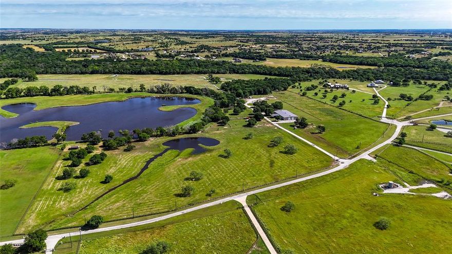 Located on the border of Justin and Ponder, Texas, discover a ranch estate with lush woods and sprawling pastures perfect for cattle, horses, or hunting. The property features a 12,000 square foot barndominium with 3,738 sqft of living quarters including 3 br's and 3 ba's with a steam shower. If you love entertaining, you won't find a better area than the media room with a full bar that opens up to the shop. Great for hosting parties! Blending rustic charm with modern comfort this barndo is set up perfectly. Situated along Denton Creek, the ranch offers access to a private lake, ideal for relaxation and recreation. For outdoor enthusiasts, the ranch provides prime hunting grounds with deer, turkey, and hogs. Property also features a high low skeet range. Ranch is cross fenced with working pens for cattle. 25x50 lean to with attached chicken coop. Less than 45 minutes to DFW Airport and downtown Fort Worth. Come enjoy country living at it's finest!