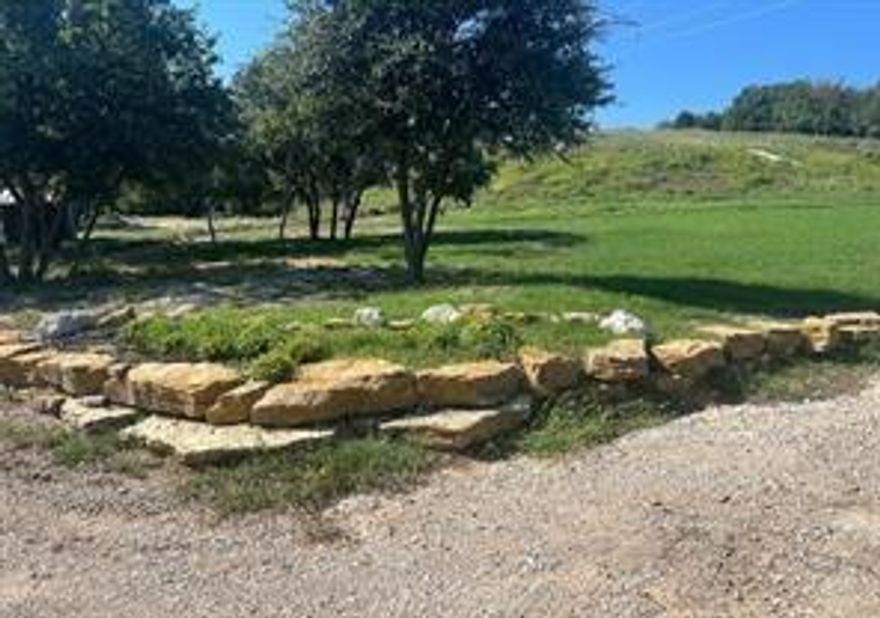 This is absolutely one of the most stunning parcels in Parker County to build your dream home on! This parklike 2.67 acres offers several different areas that would make a great building spot determined by your preference of high on a hill or in the tree grove! There are 2 wells already on the property - use one for your new home and one for lawn and gardening! This gated community offers peaceful, easy living with luxury homes in a beautiful country setting. There is a minimum of 2250 s.f. for new homes. Workshops are not to exceed 2400 s.f. If you are ready to make a lifestyle change to country living, this is your opportunity!  Seller says to bring a good offer!!
