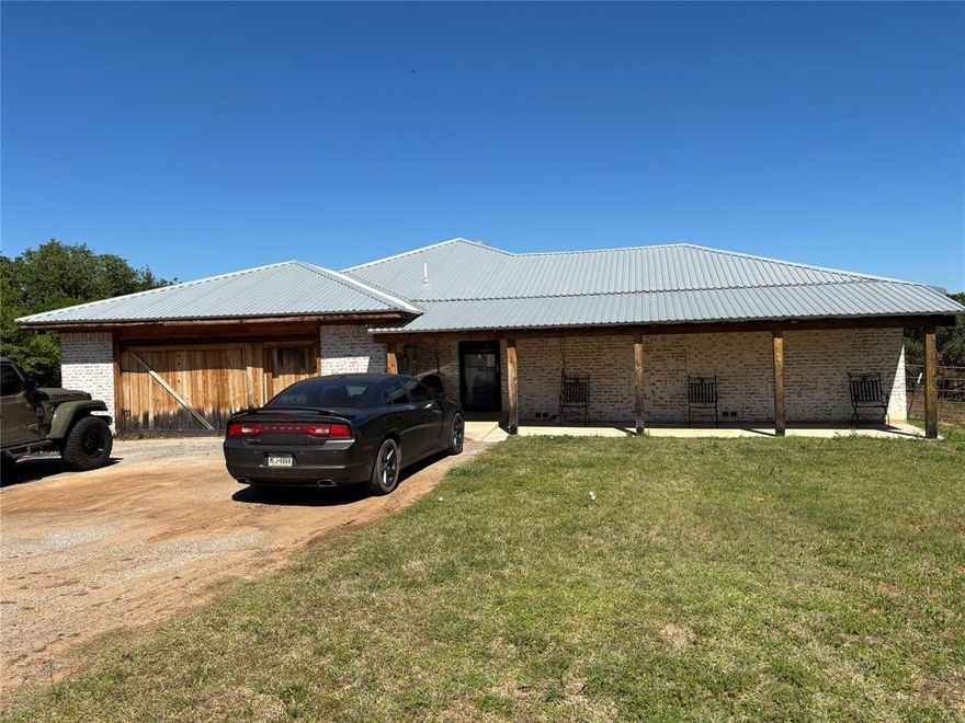 Endless possibilities await on this unrestricted 5.94-acre property, perfect for personal living, farming, business ventures, or all of the above.

This home features 4 bedrooms, 2 bathrooms. New oven stove, dishwasher, and floors! Updated kitchen with custom cabinets. 6x8 pantry, large enough for an additional freezer and refrigerator. 11x12 Laundry room has hook ups for 2 Washing Machines and 2 Dryers, space for additional refrigerator and freezer. 
Large, covered patio on one side of the house and a covered porch on the other side.
Home features 2-50 gallon water heaters, one 10 ton AC and one 6 ton AC, both less than 2 years old. Metal roof, approximately 2 years old.

Mother in law-Guest quarters include 2 bedrooms and 1 bathroom, located inside the home at the front.

ALL OUTSIDE EQUIPMENT, MATERIAL, CONTAINERS AND CARS WILL BE REMOVED PRIOR TO CLOSING. 
Home will be professionally cleaned as well.