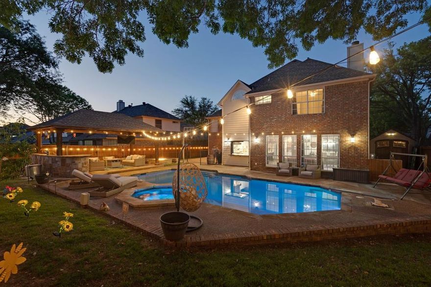 Welcome to this beautiful home located in the highly desirable Glenwick Estates in Flower Mound. With the spacious open floor plan and thoughtfully designed layout, this home is perfect for both comfortable living and entertaining. The heart of the home is the beautifully appointed kitchen that opens to an inviting living and dining space. Enjoy effortless indoor-outdoor living with a kitchen serving window that opens up to the poolside bar. Enjoy your days and evening winter or summer in your backyard oasis, featuring a heated pool with spa and oversized fire pit, outdoor shower and pool bath perfect for summer fun and evening gatherings. Upstairs tucked away you will find a private mother-in-law suite with private bath offering ideal space for guests or extended family. This property truly has it all. Location is a bonus right down the street from Glenwick Park, with a fabulous playground, walking distance around the corner to the baseball field, pickleball courts and tennis courts. Shopping and grocery stores just minutes away.