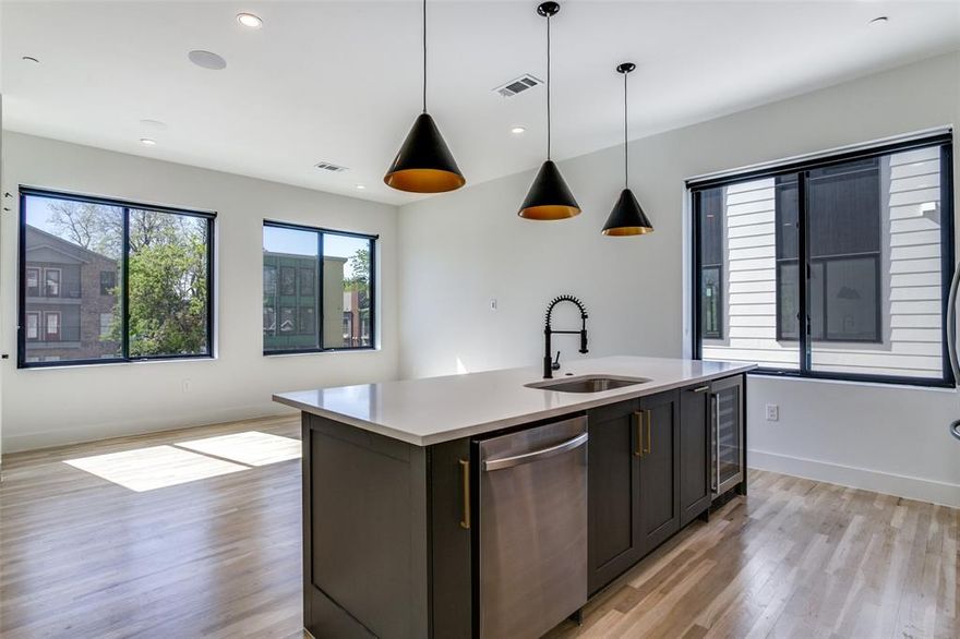 SPECIAL! 1 month FREE with 15 month lease term. Luxury townhome community featuring high-end finishes, a premium smart home package & superior energy efficiency. Fantastic end-unit with a private yard & a two-car garage on the first level. Head upstairs to the expansive living spaces with an open floor plan, complemented by beautiful hardwood floors & soaring windows that flood the rooms with natural light. Enjoy the chef’s kitchen, equipped with a sprawling island, stunning wood cabinetry, quartz countertops, pantry & high-end appliances. Retreat to the primary suite, where vaulted ceilings, a spacious bedroom, a walk-in closet & a spa-like bath await. Effortlessly manage your smart home with the Brilliant Smart Home hub or app, allowing you to control lights, the Ring doorbell, Ecobee thermostats & built-in Sonos speakers with ease. Located with immediate access to some of the city's finest bars, restaurants, shops, & parks. Photos are of unit 101 which is the same floorplan.