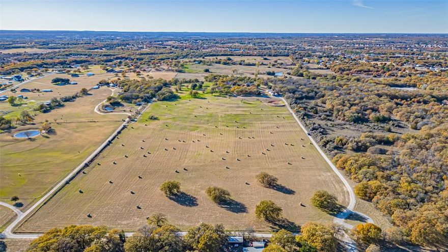 Enjoy this incredible opportunity to own your own beautiful piece of Texas! This expansive 22.8-acre tract in Azle, TX has been thoughtfully divided from the original parent tract and is now ready for its next visionary owner. Located within the highly regarded Azle ISD, this land offers the perfect balance of convenience and seclusion—just minutes from shopping, dining, and everyday essentials, yet completely removed from the hustle and bustle of city life.

As you enter the property, you’ll immediately feel the privacy, peace, and wide-open tranquility that make this area so special. The land is flat, buildable, and entirely usable—no floodplain, no HOA, and no known restrictions—giving you unparalleled freedom to create whatever you envision. Whether you dream of building a custom estate, multi-home compound, or family ranch, or prefer to subdivide into 1-acre or 5-acre tracts, this property offers limitless potential. Investors and developers will appreciate its suitability for a future RV park, mobile home community, or commercial use thanks to its unincorporated Tarrant County location and flexible land-use possibilities.

Every evening, enjoy the breathtaking Texas sunsets that stretch across the horizon, painting the sky in unforgettable colors as you unwind in your own private retreat. The peaceful surroundings and natural beauty make this an extraordinary setting for anyone seeking space, serenity, and the freedom to design their land to fit their lifestyle.

No flood plain. No HOA. No restrictions. Just pure Texas land—ready and waiting for its new owner. Opportunities like this rarely come along in such a desirable location. Come experience the sunsets, the space, and the potential for yourself!