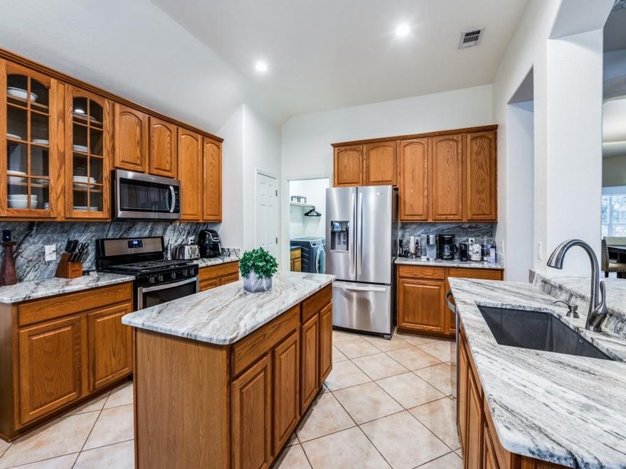 VERY LIVABLE, SPACIOUS AND FLEXIBLE 4 BEDROOM SINGLE STORY. With 2 living areas, 2 dining areas and 4 bedrooms there's enough space for everyone in this home. An UPDATED KITCHEN boasts stainless appliances, exotic granite and glass door cabinets is great for cooking, baking and entertaining. Plus a large second pantry or extra storage nearby is great useable space. The secluded primary bedroom with UPDATED ENSUITE BATH has oversized shower and upgraded fixtures plus separate vanities and soaking tub makes relaxing space space for everyone. 4th bedroom is split and would also make a great study or gameroom. A comfortable family room with corner fireplace overlooks the backyard. Enjoy the backyard from a nice sized covered deck with views for miles. Carter Ranch neighborhood has community pool, park and fishing pond. Plus neighborhood elementary school is just a few blocks away. Great commute location with access to Outer Loop, US380, DNT and Preston.