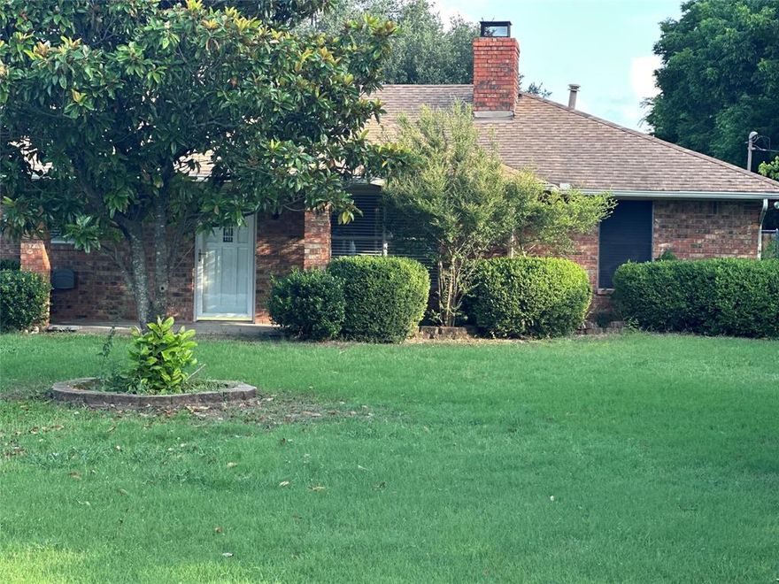 Enjoy country-style living right in the city. Sitting on just over an acre at the end of a quiet dead-end street, this home offers space, privacy, and comfort. Inside, you’ll find two huge living areas. It has a split bedroom floor plan, and the large primary bedroom comes with a great closet. The main living area features a charming brick wood-burning fireplace, perfect for the holidays and cozy nights. Oversized breakfast area, includes a build-in hutch. 30 x 18 covered porch with a sink!