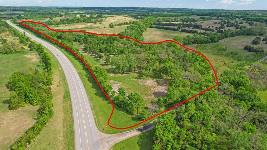 15.45 acres offering approx. 2,605 ft of highway frontage along TX-11, delivering exceptional visibility and access in a steadily growing corridor just outside Sherman.

This tract features electric available on site with pole from GCEC, with water located nearby (approx. 1” residential line ~100 ft north and 3” line ~200 ft south—buyer to verify location, size, and capacity). The natural topography provides strong drainage toward Cedar Creek, which runs along the property, creating both character and functionality.

With its long stretch of frontage, flexible layout, and surrounding open land, this property presents strong potential for a variety of uses, including RV park or storage development. Preliminary plans have been previously considered for an approx. 50-unit RV park—buyer to verify feasibility, zoning, and all development requirements.

Conveniently positioned with quick access to Highway 75 and the Sherman growth path, this location offers a rare combination of exposure, accessibility, and long-term upside.
