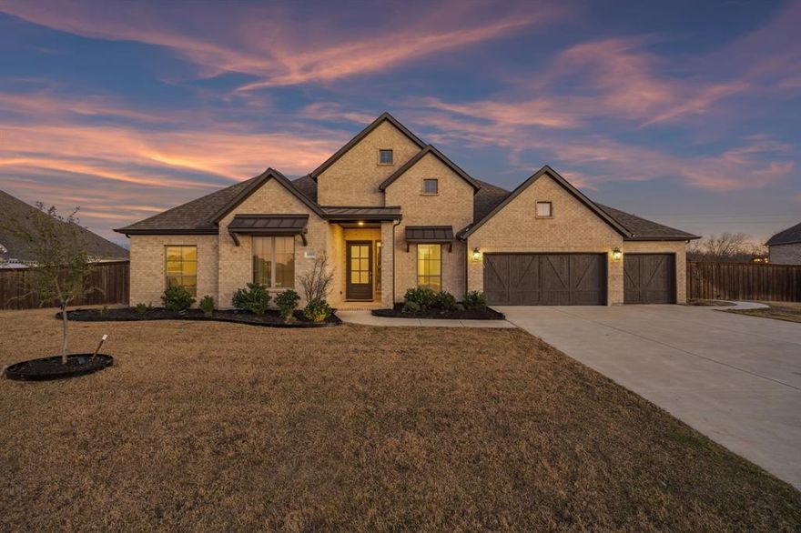 Feels like new, only better! Nearly $150k in upgrades at at remarkable price! This exceptional single-story residence sits on a rare half-acre homesite with no neighbors behind, offering privacy, space, and effortless modern living. Warm finishes and contemporary touches create an inviting home designed for connection, indoors and out.

Gather family and friends beneath the covered patio, unwind around the fire pit, or enjoy the added sport court alongside an expansive grassy yard that is ideal for play and pups. The 3-car garage includes additional space that is perfect for a fitness or golf setup.

Inside, open-concept living and dining areas are anchored by a fireplace and framed by walls of windows, filling the home with natural light. The kitchen features a grand island and walk-in pantry, ideal for entertaining and everyday living. A spacious game room with French-door entry is tucked just off the main living area.

Vaulted ceilings elevate the private owner’s retreat, complete with a spa-inspired bath offering dual vanities, two walk-in closets, a center garden tub, and a separate glass-enclosed shower. Secondary bedrooms share a Jack and Jill bath, while a private guest suite with its own bath and a dedicated study are located at the front of the home.

Community amenities include a clubhouse, tennis courts, walking trails, parks, and ponds, all just minutes from lake life and within an hour of Dallas conveniences.