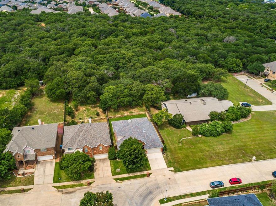 Rare Opportunity to own this 4 bed 3 full bath home in N Fort Worth with Excellent Keller Schools.  The Secluded location coupled by the 238ft Deep Lot offers endless possibilities to add a Pool, create a Garden or just enjoy a Quiet, Relaxing Evening on the Covered Patio.  Inside you’ll discover a warm inviting floor plan with Fresh Paint throughout, Luxury Vinyl Plank Flooring in the Large Living Room accented by a Gas Fireplace Overlooking the Natural Beauty of the Backyard. The Kitchen has abundant Cabinetry, Gas Cooktop, Granite Counters, Stainless Steel Appliances & a Huge Pantry.  The Formal Dining is Versatile and can be used as a Study or Play Space. The Primary Suite is Amazing with an Entry Sitting Room that could also be used as a Study or place a Baby Crib, the options are unlimited.  The Primary Bath is Open & Bright with Separate Garden Tub & Shower featuring a Spacious Closet.  Bedroom 2 has LVP Flooring & Shares a Full Bath with Bedroom 3 which just received New Carpet.  Bedroom 4 is located in the front of the home & also has New Carpet.  Upstairs is a Terrific Bonus Room that is supported by a Full Bathroom.  Place a Large Screen TV with Movie Chairs or create Bedroom 5 or even make it an Office Space for privacy, this space can grow & change over time to meet your needs. Other Improvements include 2nd Floor AC Replaced in 2025, Fence Stained in 2023, Backyard Sod added in 2026.  This home is in Great Condition & Ready to Move in Immediately.  Happy Mother’s Day to all the moms, this would certainly make a Great Gift !
