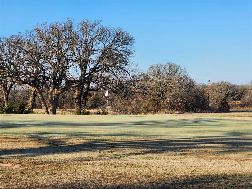 Golfers dream this beautiful build site over looking holes 1 and 9 on golf course. Property is 2 lots combined totaling .57acres. This amazing lot backs up to golf course and h as awesome views. Mature oak trees give perfect amount of shade without blocking any views. Lots are surrounded by the tranquility of nature as you will often see deer all around the property. Nocona Hills offers a 24-hour guarded gate community with access to two private lakes (one listed as top 5 Bass fishing in Texas)a community boat ramp and dock, as well as an 18-hole golf course with driving range, an airstrip, campgrounds with RV sites, and more. Utilities include co-op water and electric already at street. Fiber optic high speed internet is also available. Nearby surroundings include historic downtown Nocona, a winery, brewery and just a short drive to Saint Jo, Muenster and popular Casinos. Come see this gem. Owner has multiple lots available to choose from, please contact listing agent for details.  The Club house is under remodel along with the pool such an exciting new Update for the community.