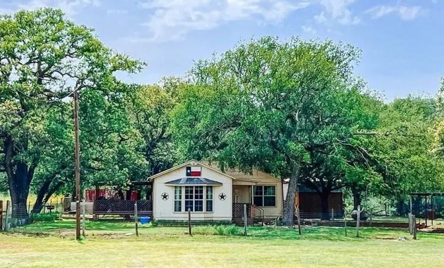 4 Bed 2 bath country home on 1.5 acres but surrounded by 100's of acres belonging to the same family for generations. Newly fenced with excellent shade for our hot Texas summers. The entrance of the home opens into a spacious living room with tons of natural light through the large front windows. Off the living room is your kitchen and dining room complete with a pantry, ready for entertaining guests with plenty of prepping and storage space! From the dining room you can extend your gathering onto the backside covered deck that has plenty of room for grilling or just enjoying the views. Just 10 miles from the heart of Brownwood on fully paved roads.