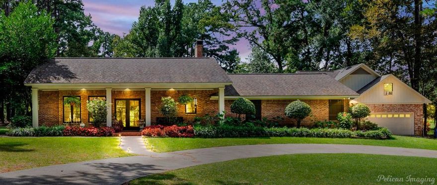 Discover the perfect blend of elegance and comfort in this exquisite ranch-style property located on a sprawling 2-acre estate in Shreveport, Louisiana. Featuring 4 spacious bedrooms, 5 full bathrooms, and 2 half baths, this meticulously designed home boasts a 3-car garage and offers ample space for luxury living and entertaining. Step inside to find an inviting and expansive open floor plan. The remodeled kitchen, a true chef's delight, seamlessly flows into the living room, where vaulted ceilings adorned with stunning wood beams create an atmosphere of rustic elegance. Complemented by timeless brick floors, this area serves as the heart of the home, ideal for gatherings large and small. The primary suite is a retreat unto itself, offering a spacious haven with two custom closets, providing ample storage for all your wardrobe needs. The large ensuite bathroom exudes spa-like qualities, perfect for unwinding after a long day. For those who appreciate a separate living space, the mother-in-law suite is a standout feature, complete with a full kitchen to accommodate extended stays or guests who desire privacy. Movie nights and game days will find a perfect venue in the dedicated media room, tailored for cinematic experiences without leaving the comfort of home. Outside, the inviting front porch captures the essence of Southern charm, welcoming you to sit and relax or entertain guests with ease. The courtyard features a pristine pool, offering a refreshing escape and a picturesque centerpiece for outdoor activities. This Shreveport gem combines luxury and functionality, providing a serene and private retreat with easy access to the conveniences of city life. Experience a lifestyle of unparalleled comfort in this remarkable ranch-style property.
Seller reserves: media foyer chandelier, wall lights next to be in master bedroom, off white cabinets in garage.